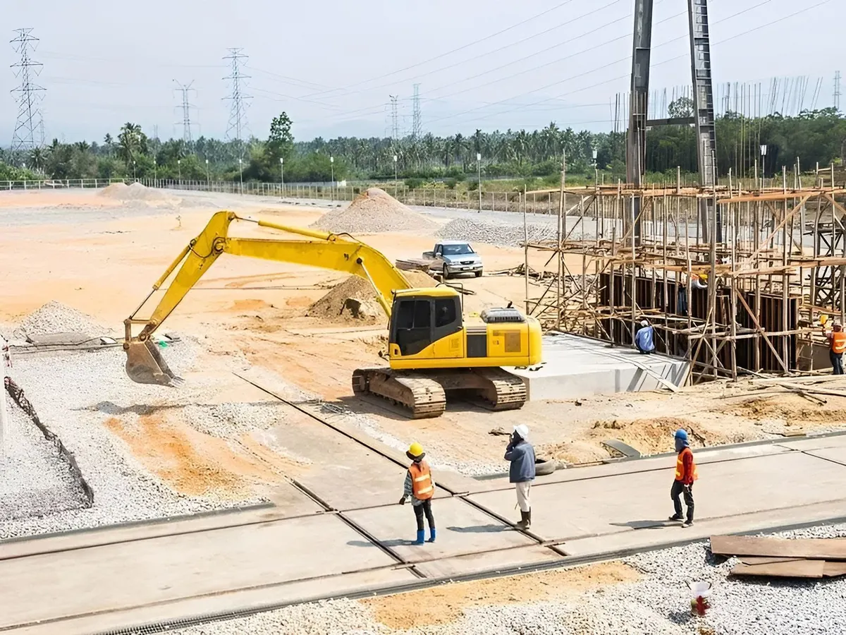 Construction site with a yellow excavator