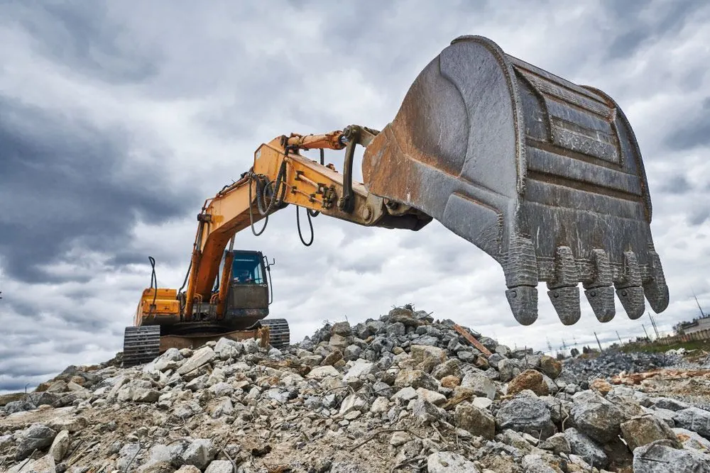 Excavator loader machine at demolition construction site